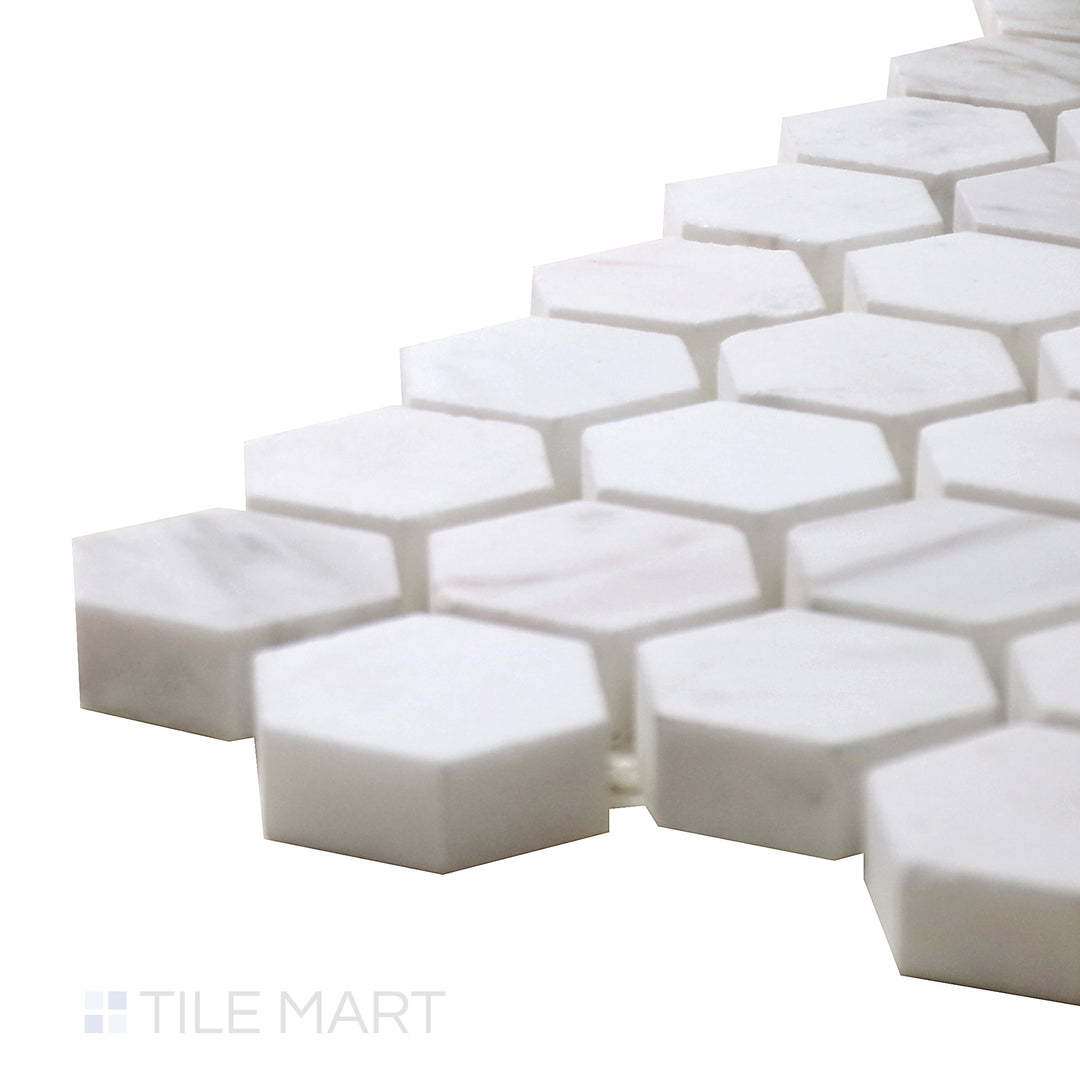 Side perspective of Sto-Re Volakas 1-1/8" Hexagon Polished Marble Mosaic, featuring subtle gray veining with a polished, smooth surface.