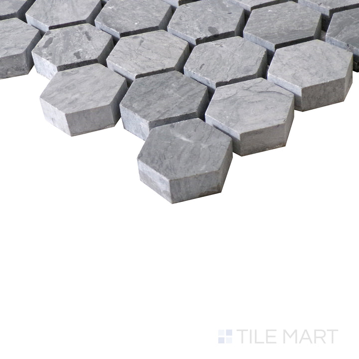 Slanted perspective of Sto-Re Wooden Blue 1-1/8" Hexagon polished marble mosaic, highlighting its unique blue-gray hues, geometric hexagonal shapes, and polished surface.  