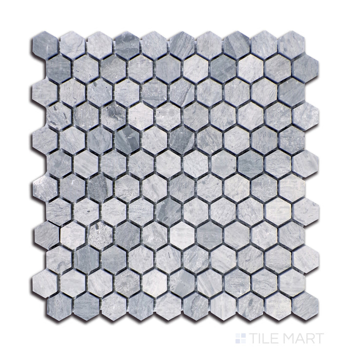 Close-up of Sto-Re Wooden Blue 1-1/8" Hexagon Polished Marble Mosaic, highlighting the bold contrast of blue-grey hues in a polished hexagonal design.