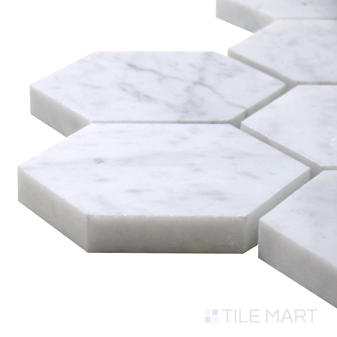 Close-up corner shot of Sto-Re Carrara 2-1/2" Hexagon Polished Marble Mosaic, featuring classic white marble with soft gray veining in a structured hexagonal format.