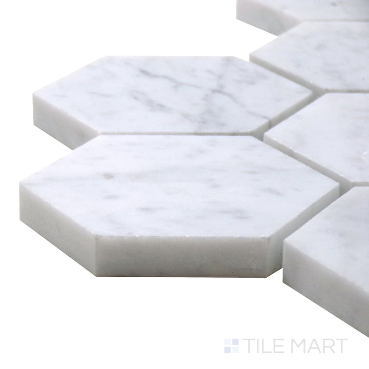 Close-up corner shot of Sto-Re Carrara 2-1/2" Hexagon Polished Marble Mosaic, featuring classic white marble with soft gray veining in a structured hexagonal format.