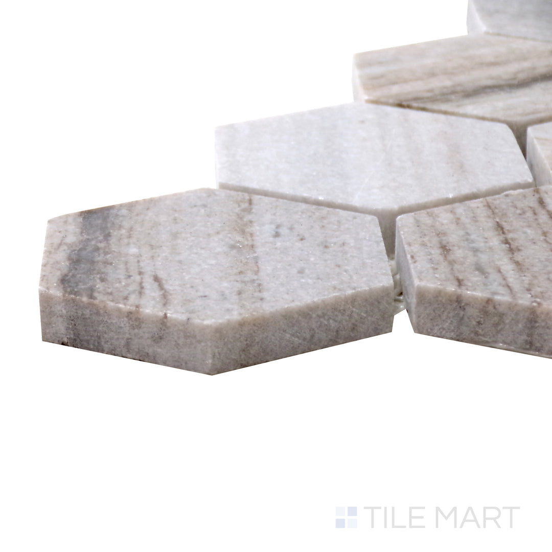 Angled perspective of Sto-Re Ocean White 2-1/2" Hexagon Polished Marble Mosaic, displaying its bright white marble with a polished finish.