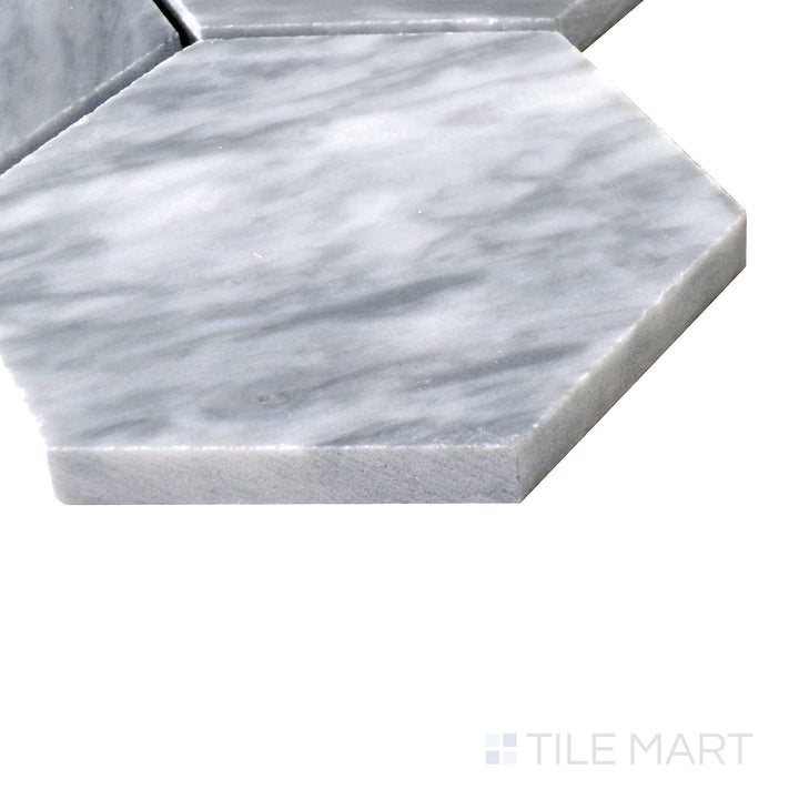 Angled shot of Sto-Re Bardiglio 4" Hexagon polished marble mosaic, showcasing its deep gray tones, large hexagonal layout, and sleek polished surface.  