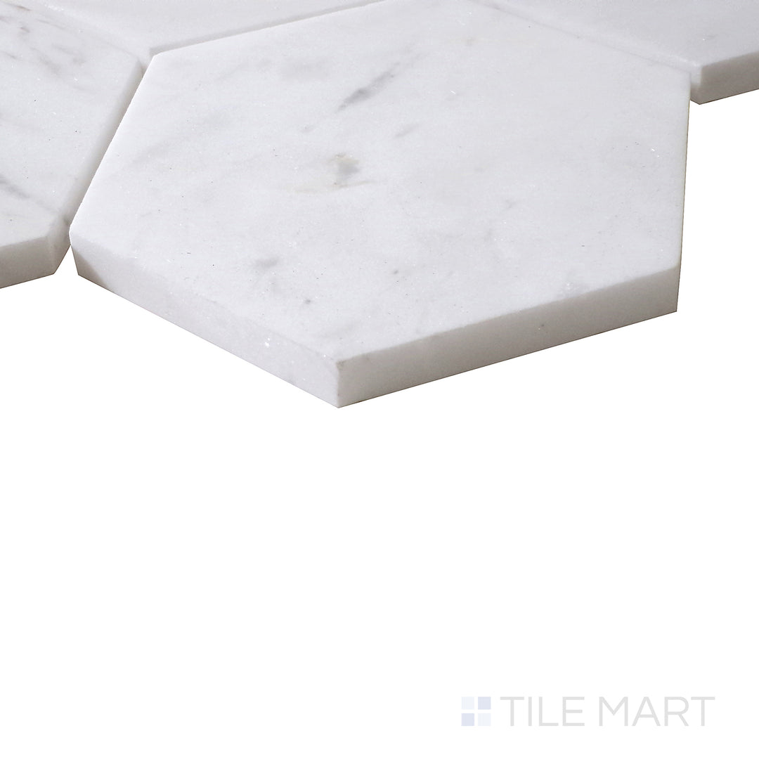 Angled view of Sto-Re Volakas 4" Hexagon polished marble mosaic, featuring its delicate veining, high-gloss surface, and structured hexagonal layout.  
