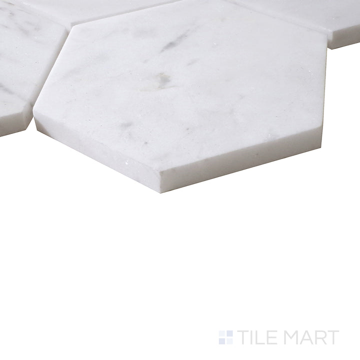 Angled view of Sto-Re Volakas 4" Hexagon polished marble mosaic, featuring its delicate veining, high-gloss surface, and structured hexagonal layout.  