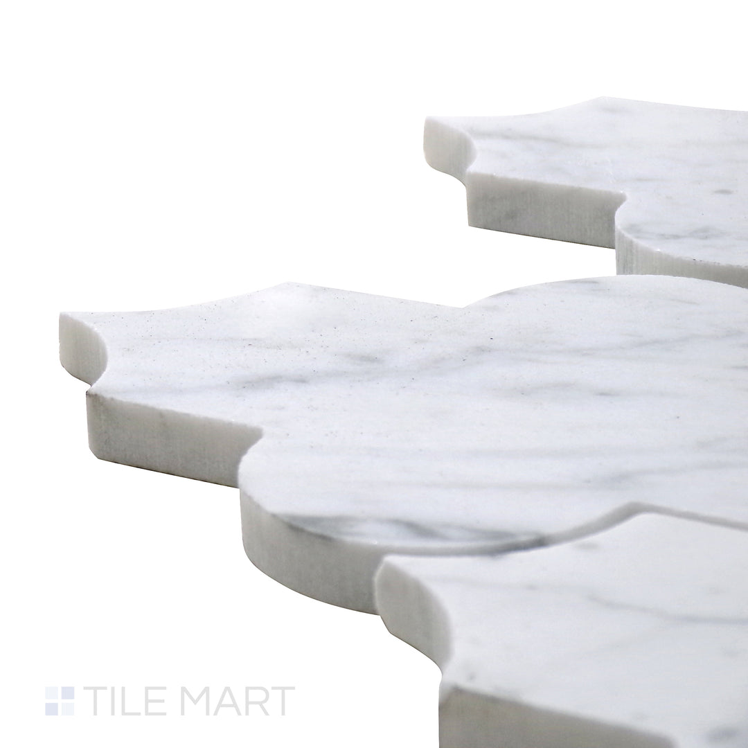 Angled close-up of Sto-Re Carrara Marrakech Pattern Polished Marble Mosaic, featuring soft white marble with subtle gray veining in an elegant Moroccan pattern.