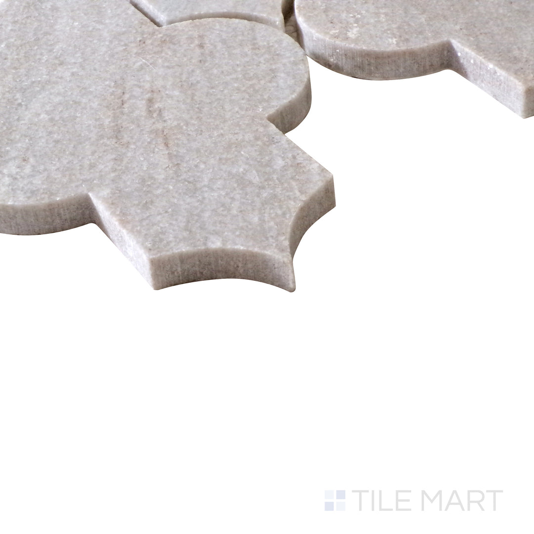 Diagonal view of Sto-Re Ocean White Marrakech Pattern polished marble mosaic, highlighting its bright white tones, smooth polished surface, and ornate pattern design.  