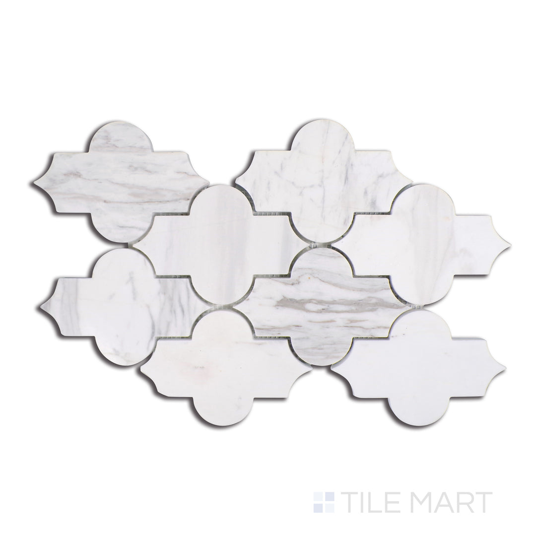 An aerial shot capturing the elegance of Volakas marble in a Marrakech geometric pattern, harmonizing soft white backgrounds with fluid gray veining for a timeless, glossy finish.