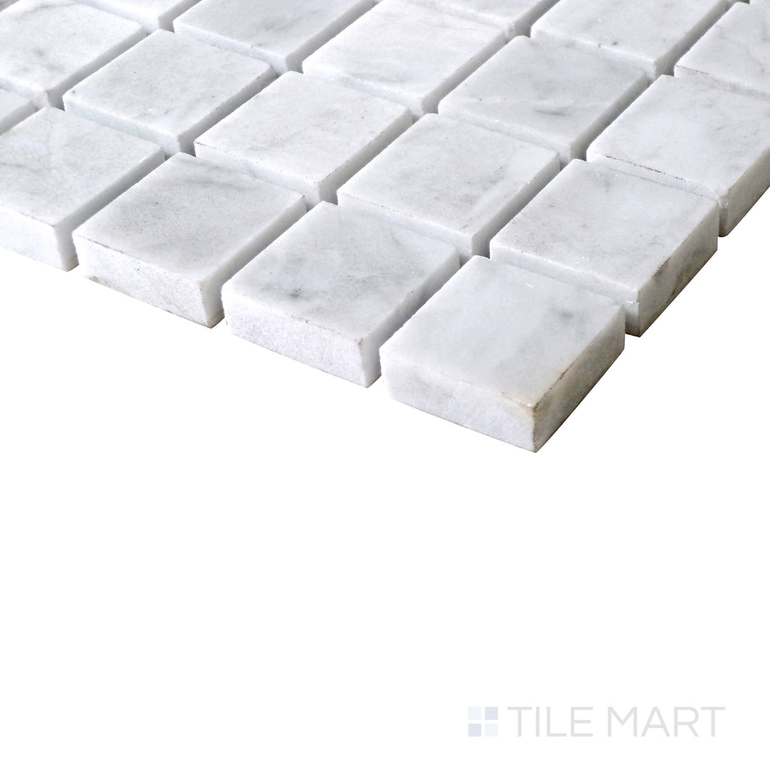 Slanted perspective of Sto-Re Carrara 1-1/8" Square polished marble mosaic, emphasizing its refined white marble base, subtle veining, and structured square arrangement.  