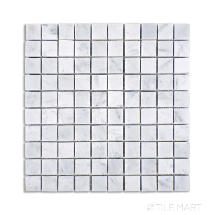 A refined aerial look at Carrara marble tiles in a compact 1-1/8" square grid, showcasing luminous white tones with subtle gray veining and a polished surface.