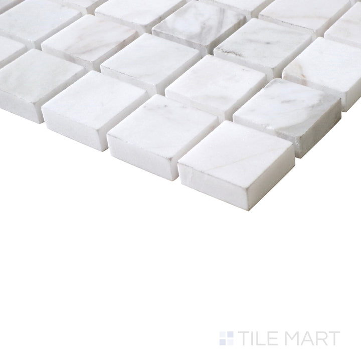 Diagonal view of Sto-Re Volakas 1-1/8" Square polished marble mosaic, capturing its soft veining, symmetrical square pattern, and glossy surface.  