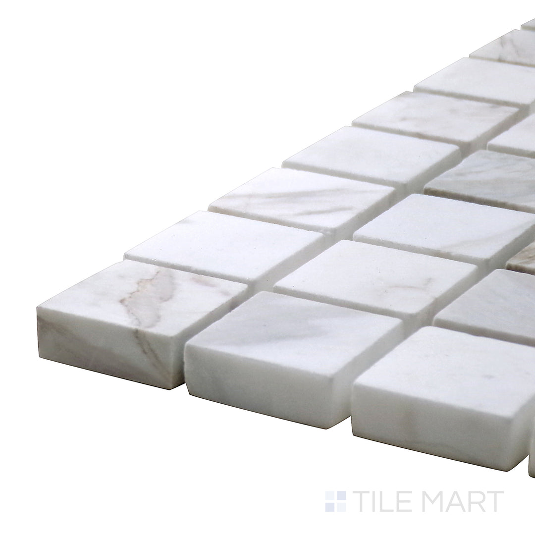 Corner-focused shot of Sto-Re Volakas 1-1/8" Square Polished Marble Mosaic, showcasing its soft gray veining with a polished square layout.