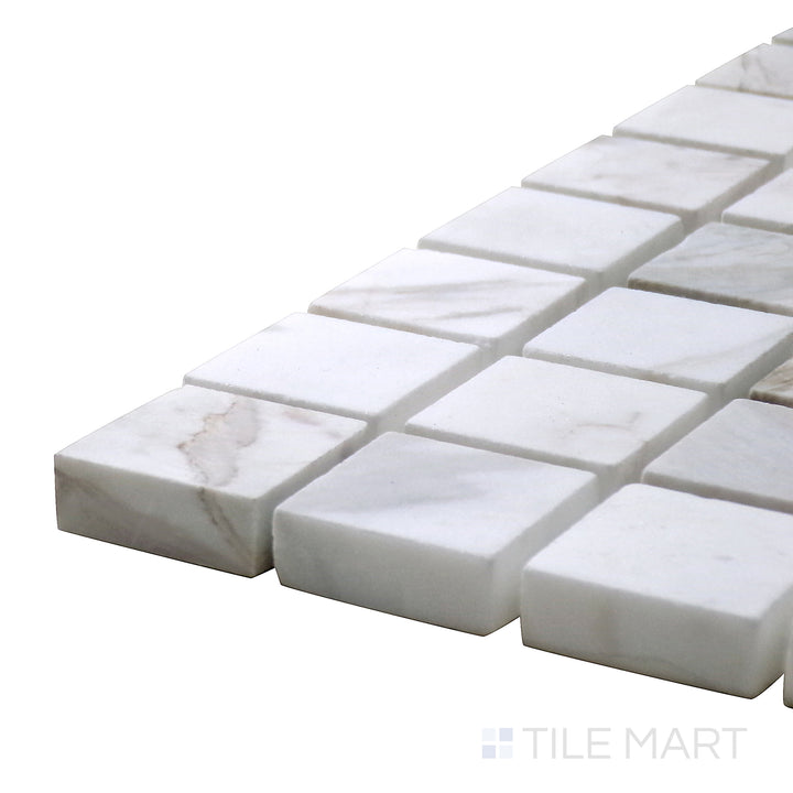 Corner-focused shot of Sto-Re Volakas 1-1/8" Square Polished Marble Mosaic, showcasing its soft gray veining with a polished square layout.