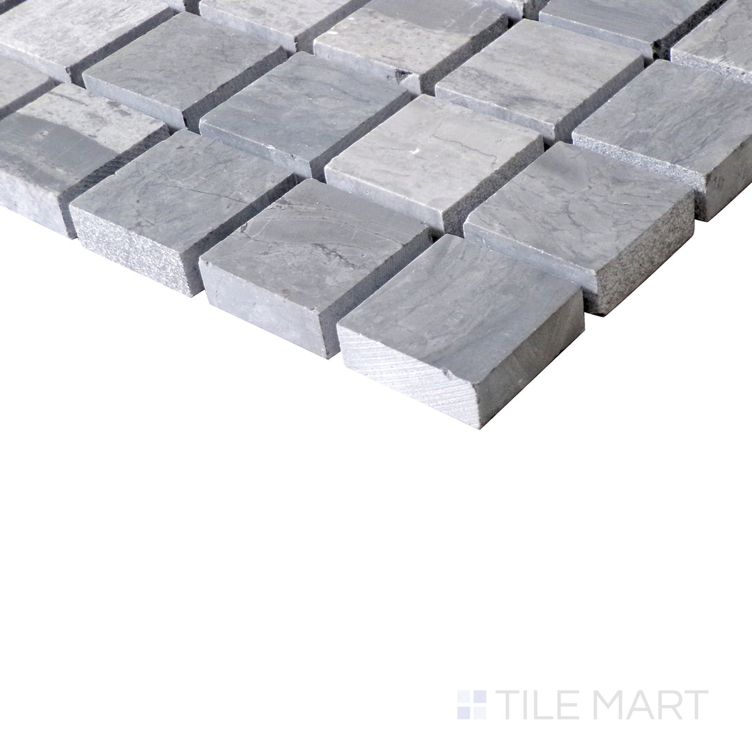 Slanted angle of Sto-Re Wooden Blue 1-1/8" Square polished marble mosaic, showcasing its unique blue-gray tones, precise square layout, and polished sheen.  
