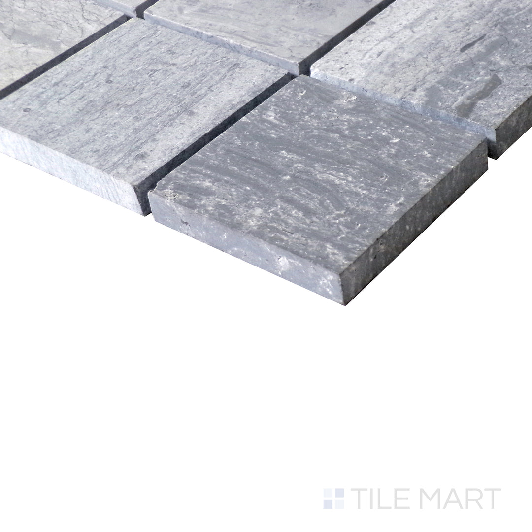 Diagonal view of Sto-Re Wooden Blue 2.25" Square polished marble mosaic, showcasing its unique blue-gray tones, structured square format, and glossy finish.  