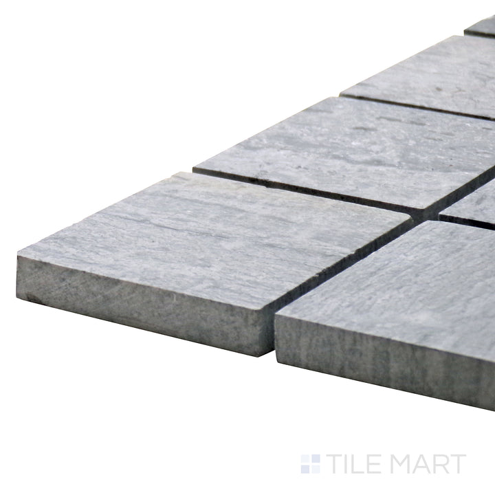 Detailed corner shot of Sto-Re Wooden Blue 2.25" Square Polished Marble Mosaic, emphasizing its blue-gray tones with a sleek square layout.