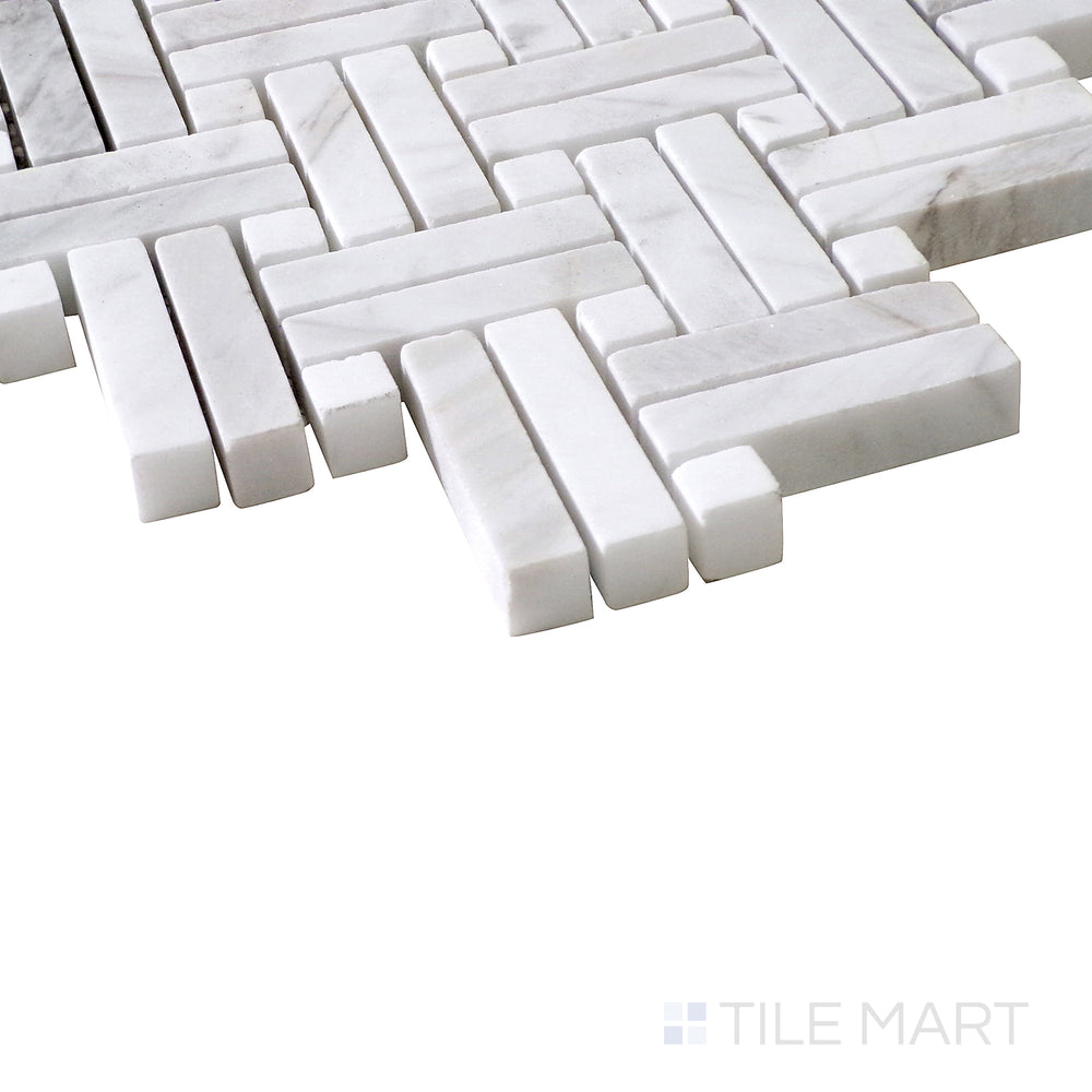 Slanted shot of Sto-Re Volakas with Volakas Dot Stanza polished marble mosaic, emphasizing its soft veining, matching dot accents, and high-gloss finish.  