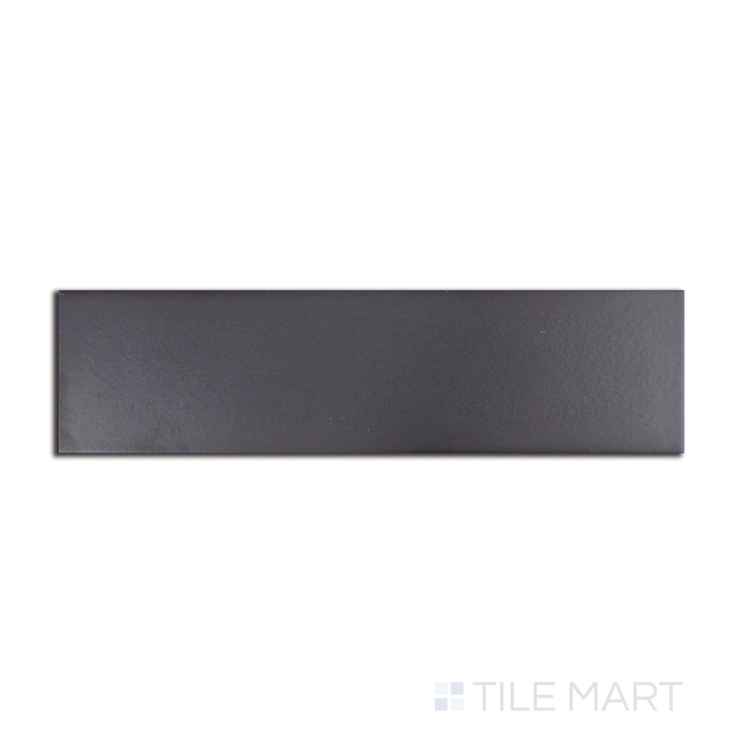 Deep black with urban-inspired undertones, this Stromboli Black City matte tile is arranged in a 3.5x14.5-inch layout, offering a striking visual from a top-down angle.