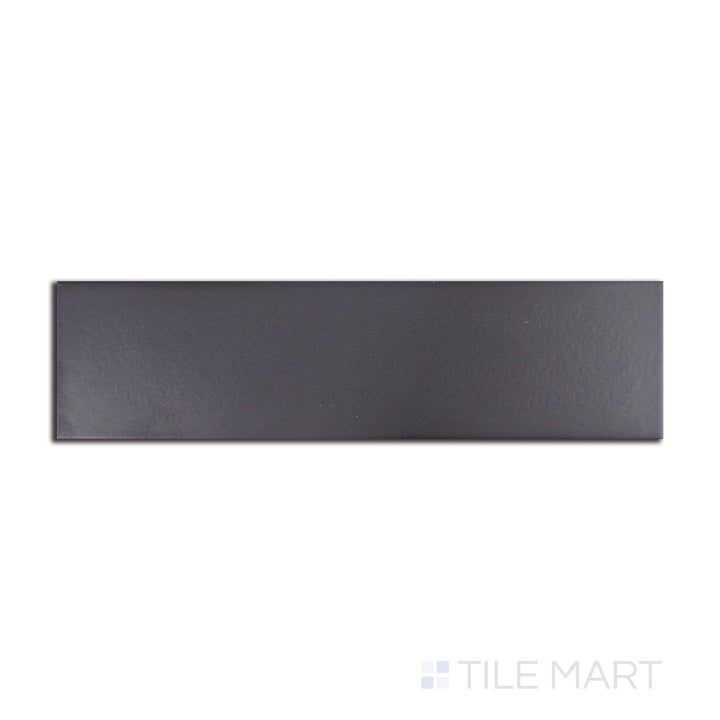 Deep black with urban-inspired undertones, this Stromboli Black City matte tile is arranged in a 3.5x14.5-inch layout, offering a striking visual from a top-down angle.