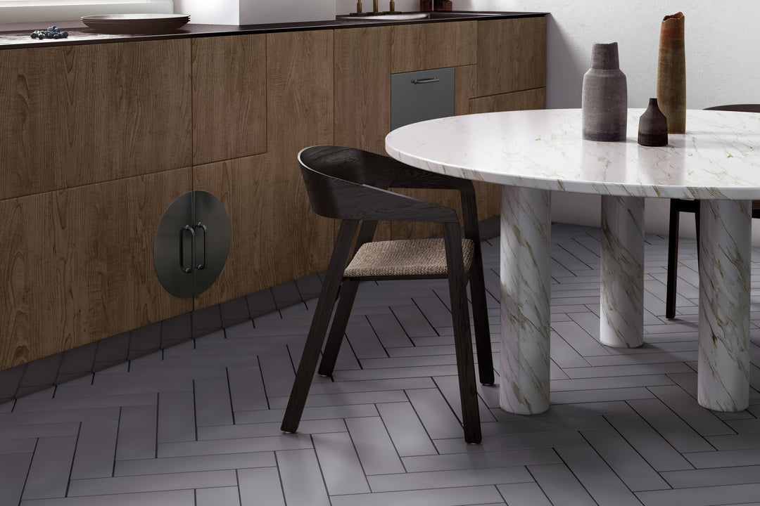 A chic and neutral interior highlighted by Stromboli Simply Grey 3.5X14.5 Matte Porcelain, perfect for contemporary styling.