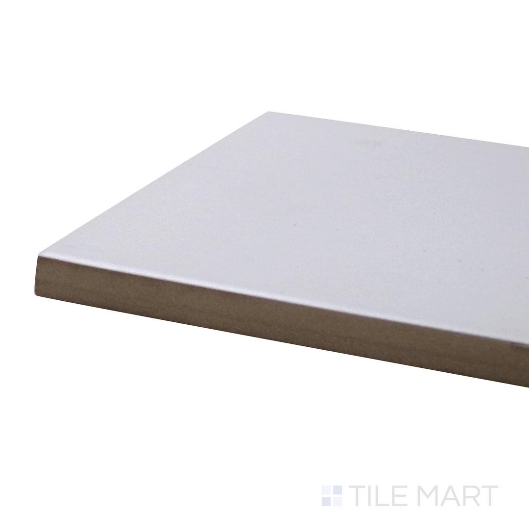 Corner angle of Stromboli White Plume 3.5X14.5 Matte Porcelain Tile, emphasizing its soft white tones and gentle texture in a refined matte finish.