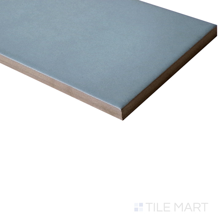 Diagonal shot of Stromboli Bahia Blue 3.5x14.5 matte porcelain tile, emphasizing its vibrant blue color, sleek matte texture, and stylish elongated format.  