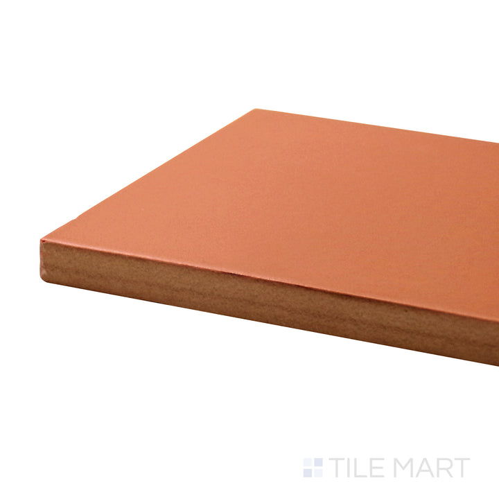 Angled close-up of Stromboli Canyon 3.5X14.5 Matte Porcelain Tile, featuring earthy tones and a rugged matte surface inspired by natural rock formations.