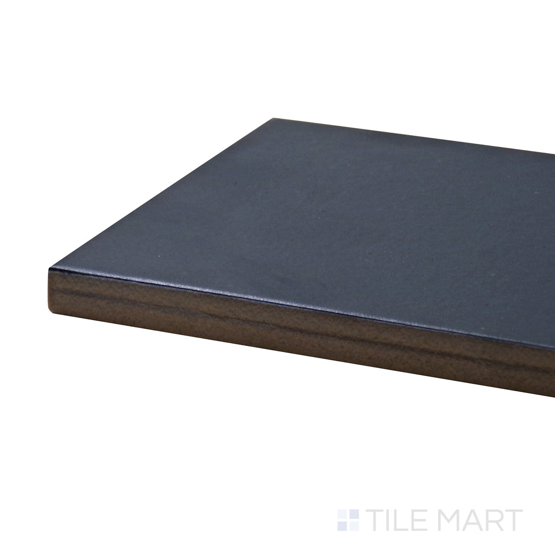 Corner-focused shot of Stromboli Glassy Blue 3.5X14.5 Matte Porcelain Tile, highlighting its rich blue color with a smooth, matte surface.