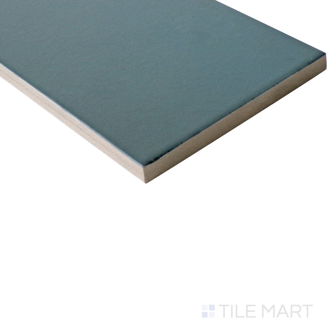 Diagonal view of Stromboli Viridian Green 3.5x14.5 matte porcelain tile, featuring its deep green hue, sleek surface, and sophisticated matte appeal.  