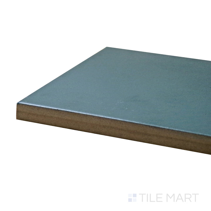 Close-up corner shot of Stromboli Viridian Green 3.5X14.5 Matte Porcelain Tile, capturing its vibrant green hue and contemporary matte texture.