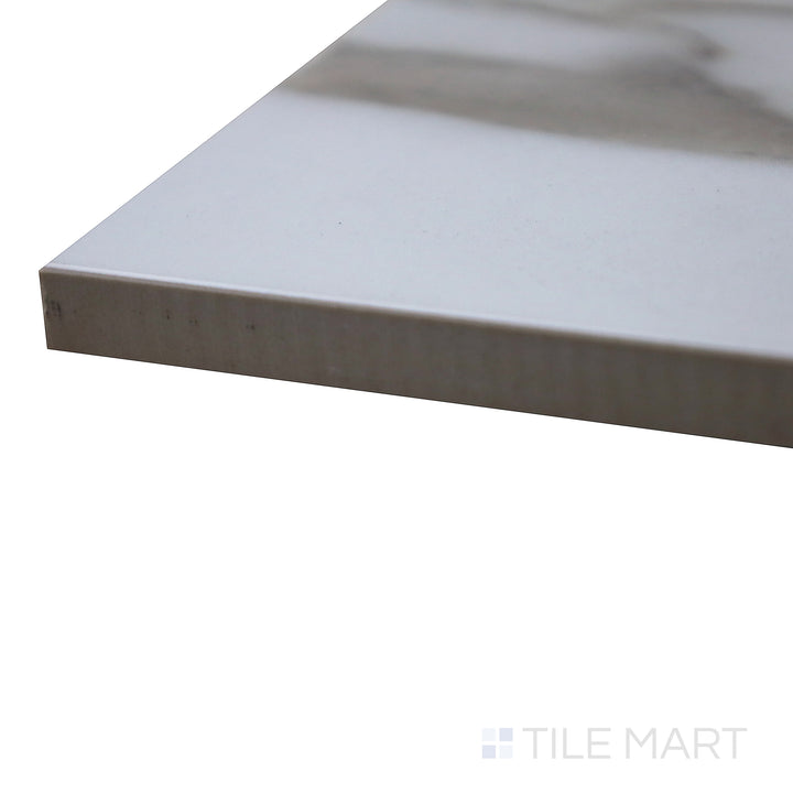 Corner shot of Supreme Evo Antique White 24X48 Polished Porcelain Tile, featuring a polished white marble-like surface with soft veining for an elegant look.
