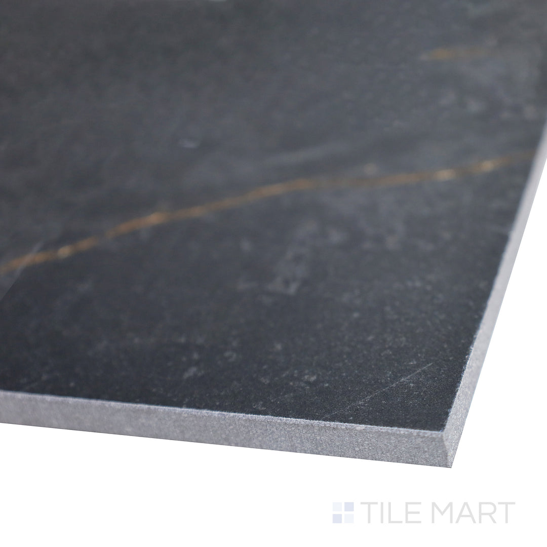 Slanted shot of Supreme Evo Noir Laurent 24x48 polished porcelain tile, emphasizing its luxurious black base, striking veining, and high-gloss polished finish.  