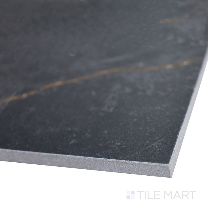 Slanted shot of Supreme Evo Noir Laurent 24x48 polished porcelain tile, emphasizing its luxurious black base, striking veining, and high-gloss polished finish.  