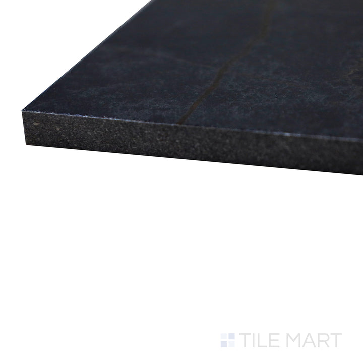 Angled view of Supreme Evo Noir Laurent 24X48 Polished Porcelain Tile, showcasing its dramatic black marble design with striking gold veining.