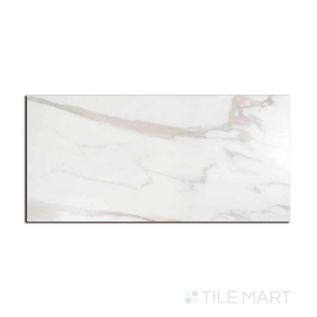 Top-down view of Tele Di Marmo Reloaded Calacatta 12X24 matte porcelain tile, featuring a crisp white base with striking gray veining for a timeless marble look.
