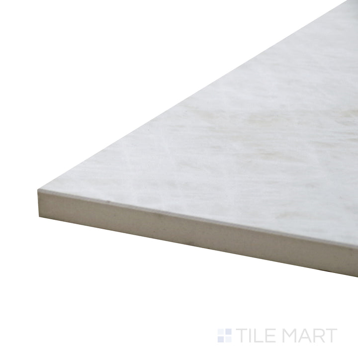 Angled view of Tele Di Marmo Reloaded Quarzo 12X24 Matte Porcelain Tile, showcasing its soft quartz-inspired white surface with subtle veining.