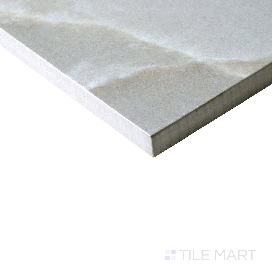 Slanted angle of Tele Di Marmo Reloaded Onice Klmt 12x24 matte porcelain tile, capturing its unique onyx-inspired veining, soft color variations, and luxurious matte surface.  