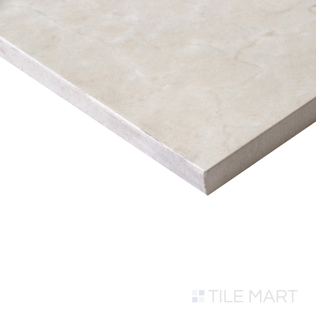 Diagonal view of Tele Di Marmo Reloaded Marfil 24x48 matte porcelain tile, featuring warm beige tones, soft marble-like veining, and an elegant matte texture.  