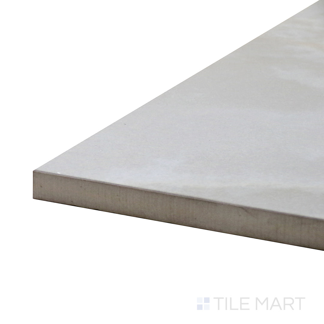 Angled close-up of Tele Di Marmo Reloaded Onice Klmt 24X48 Matte Porcelain Tile, showcasing its elegant onyx-inspired texture with subtle color variations.