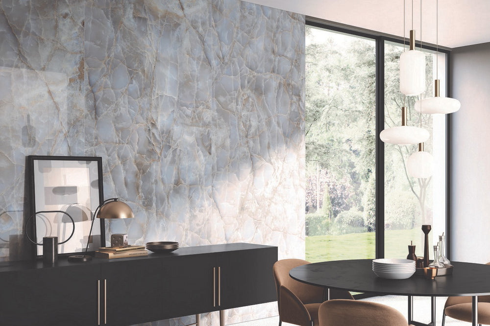 A luxurious interior brought to life with Tele Di Marmo Reloaded Onice Klmt 24X48 Matte Porcelain, showcasing a rich onyx-inspired design for a dramatic yet refined ambiance.