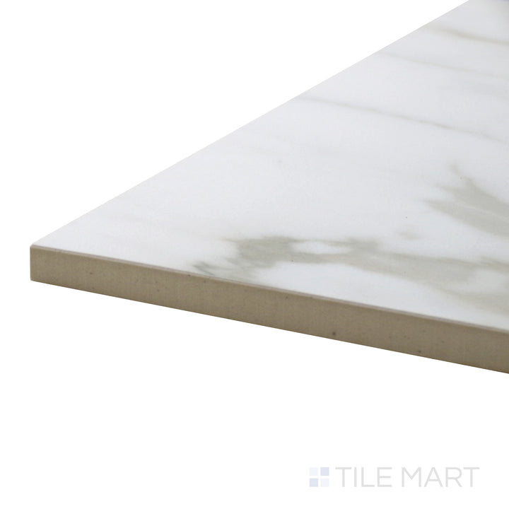 Close-up corner shot of Tele Di Marmo Reloaded Calacatta 12X24 Polished Porcelain Tile, capturing its glossy finish and rich gray veining on a pristine white background.