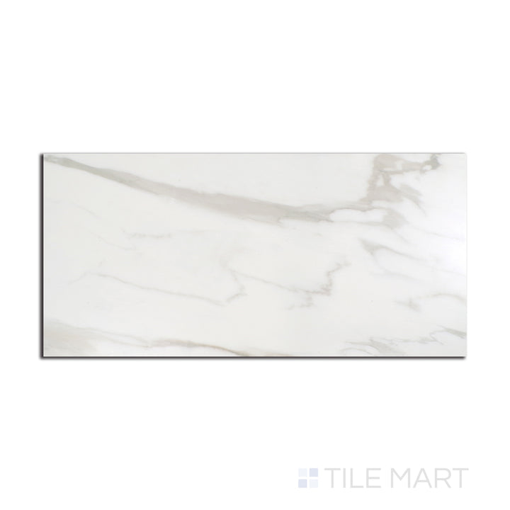 Aerial perspective of Tele Di Marmo Reloaded Calacatta 24X48 polished porcelain tile, highlighting its bold veining and smooth, glossy texture.