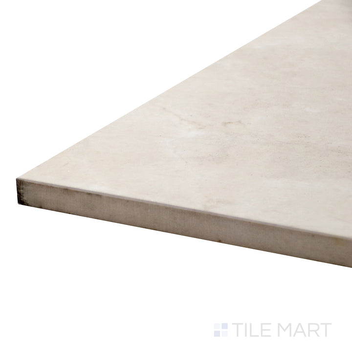 Close-up corner shot of Tele Di Marmo Reloaded Marfil 24X48 Polished Porcelain Tile, displaying its polished surface with soft beige tones and refined veining.