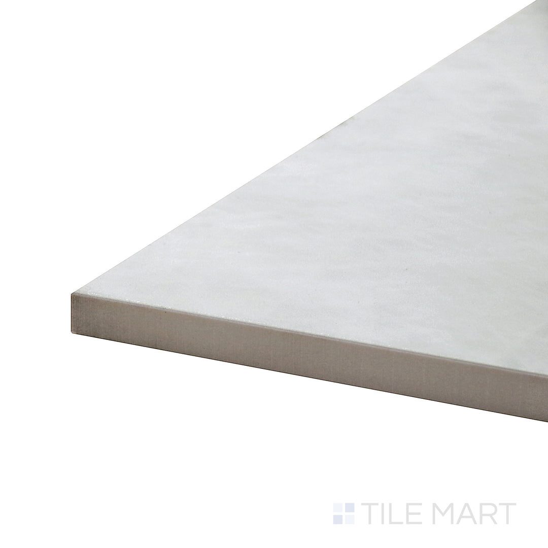 Side perspective of Tele Di Marmo Reloaded Quarzo 24X48 Polished Porcelain Tile, featuring its bright quartz-like appearance with a smooth, high-gloss surface.