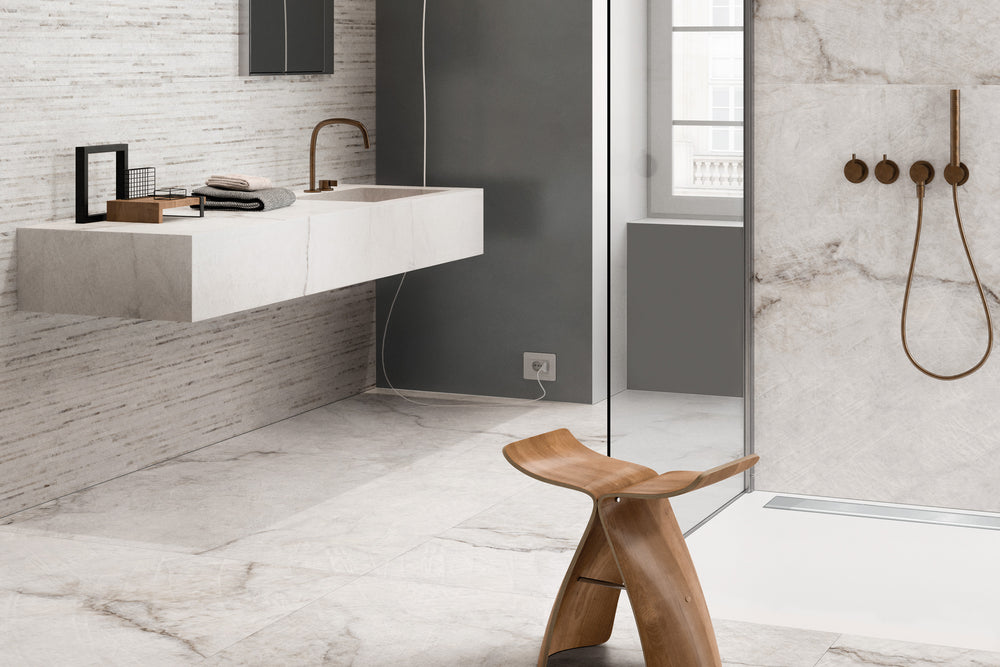 A modern and elegant interior complemented by Tele Di Marmo Reloaded Quarzo 24X48 Polished Porcelain, reflecting sophistication with its radiant quartz-inspired patterns.