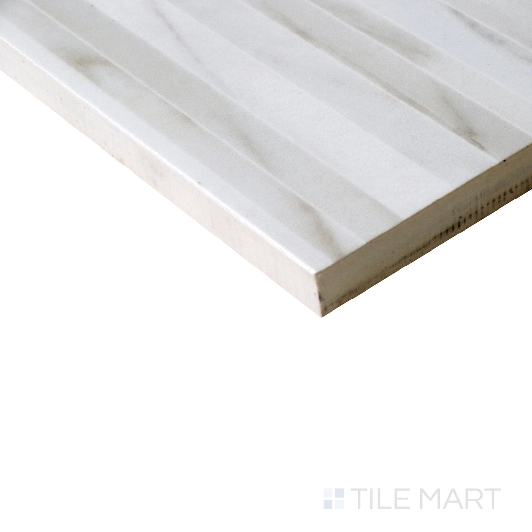 Diagonal view of Tele Di Marmo Reloaded Calacatta 24x48 polished porcelain tile, featuring crisp white tones, soft veining, and a high-end polished finish.  