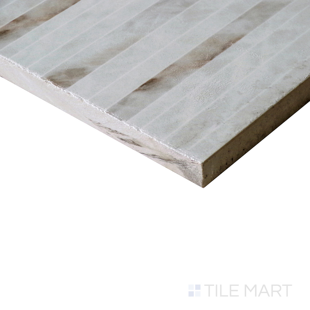 Angled view of Tele Di Marmo Reloaded Quarzo 24x48 polished porcelain tile, showcasing its soft quartz-inspired texture, neutral tones, and elegant polished surface.  