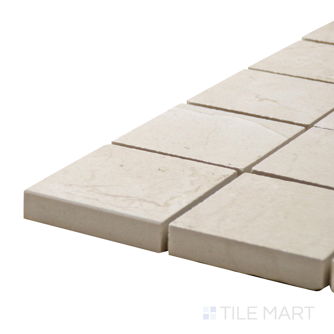 Corner angle of Tele Di Marmo Reloaded Marfil 2" Square Matte Porcelain Mosaic, emphasizing its warm beige hues and delicate veining in a structured square layout.