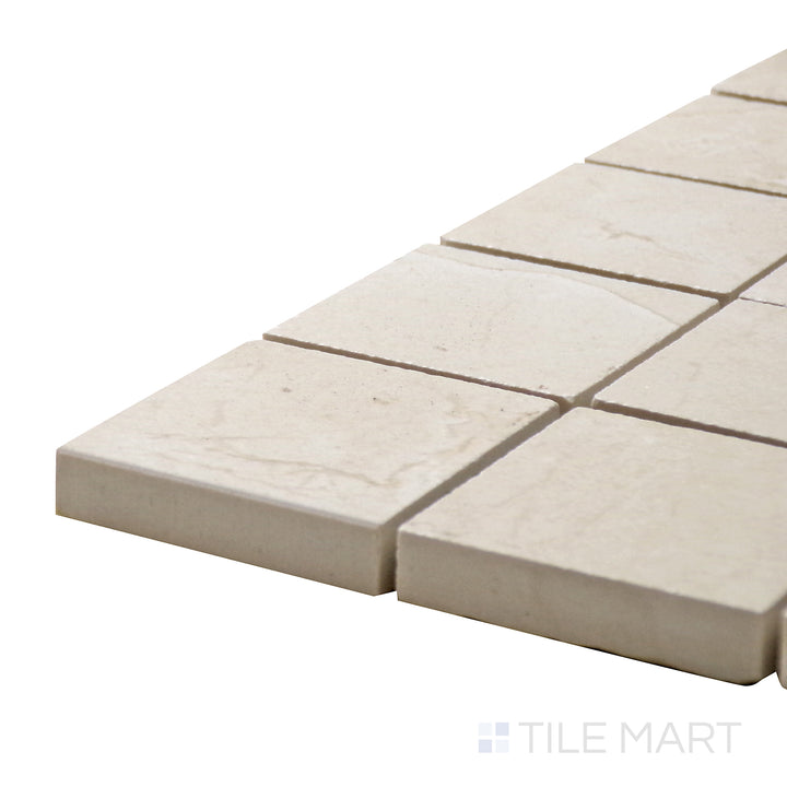 Corner angle of Tele Di Marmo Reloaded Marfil 2" Square Matte Porcelain Mosaic, emphasizing its warm beige hues and delicate veining in a structured square layout.