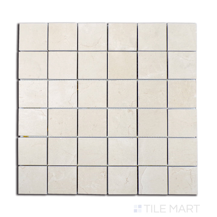 Overhead shot of Tele Di Marmo Reloaded Marfil 2" square matte porcelain mosaic, presenting a warm beige stone look with soft, natural patterns.